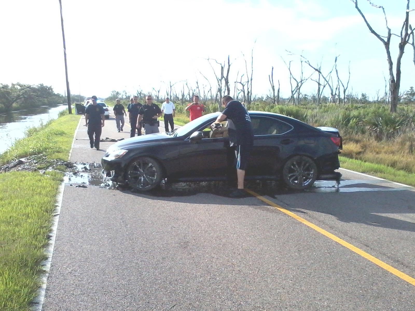 After: the same car pulled out of the water and back on the road