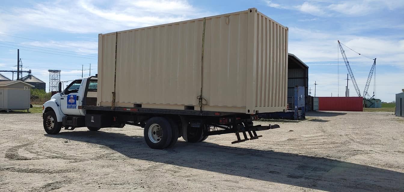 Flatbed truck hauling a shipping container