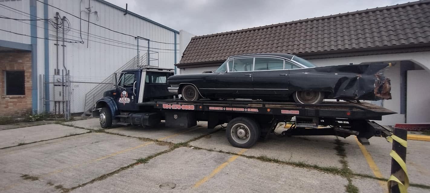 Damaged classic Cadillac loaded on the flatbed